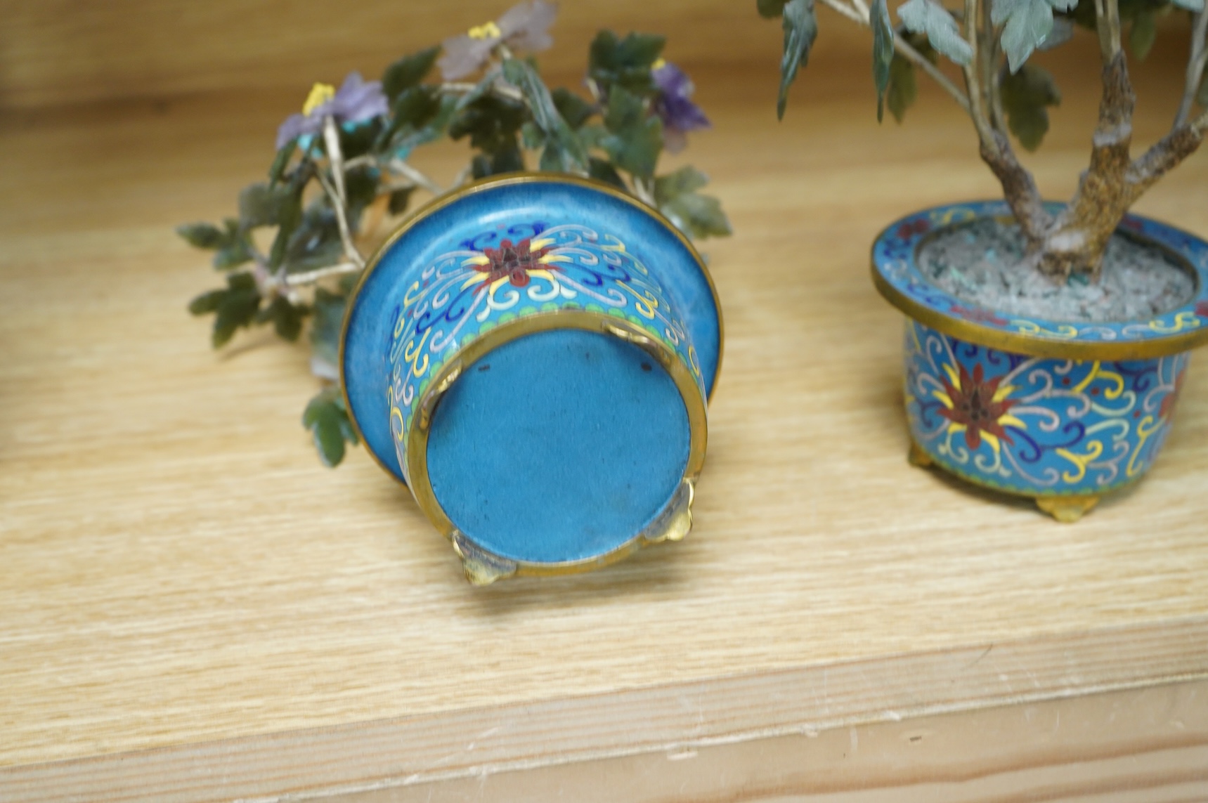 A pair of Chinese hardstone trees, in cloisonne jardinieres, 23cm high